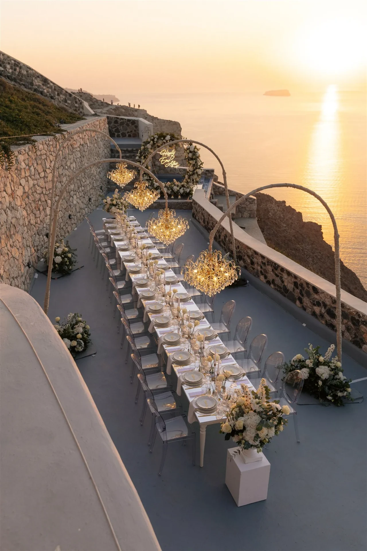 A crystal-lit table dressed for a caldera sunset